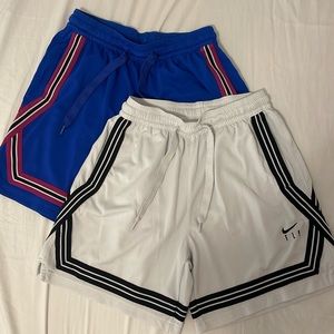 Two Pairs of Nike Swoosh Fly Crossover Shorts
